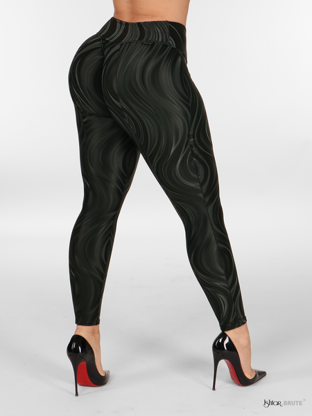Right side view of the Flora Legging in black PU fabric with a 3D wave print, emphasizing the form-flattering fit and the unique silky shine detailing.