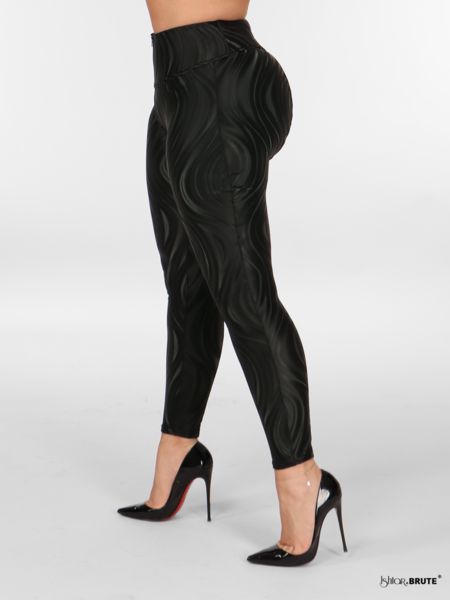 Left side view of the Flora Legging in black PU fabric with a 3D wave print, designed with a semi-shine and silky effect and luxurious velvet inside.