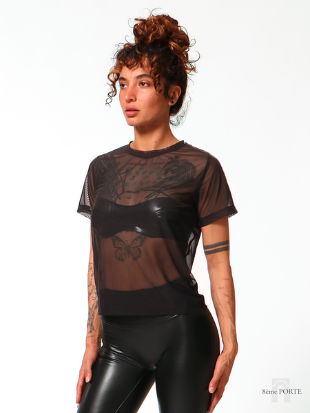 Close-up front view of the 8ÈME PORTE loose fit black mesh t-shirt showing fabric texture and neckline details.